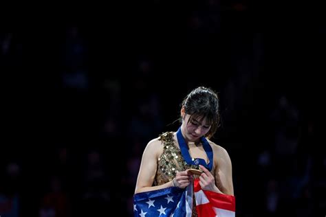 Feb 19, 2026; Milan, Italy; Alysa Liu of the United States celebrates with the gold medal in the women's free skate during the Milano Cortina 2026 Olympic Winter Games at Milano Ice Skating Arena. Mandatory Credit: James Lang-Imagn Images