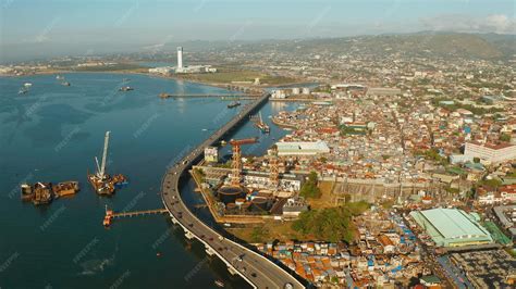 Premium Photo | City of cebu top view the port in the harbor and cargo ...
