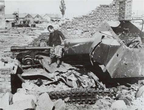 South Korean child playing on the wreck of a North Korean SU-76M SPG ...