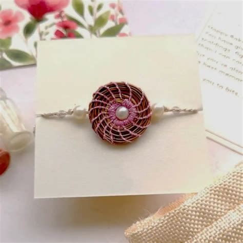 Buy Eco-Friendly Handmade Round Pearl Pine Needle Rakhi With Pouch ...