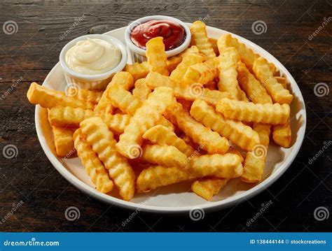 Plate of Crinkle Cut French Fries with Dips Stock Photo - Image of ...