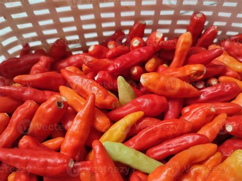 Fresh cayenne peppers that are in the basket and ready be sold ...