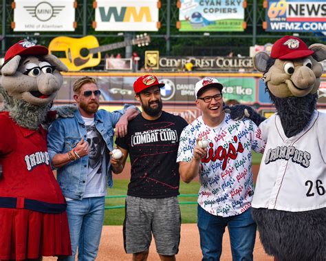 Ian Riccaboni, Orange Cassidy, and Wheeler Yuta throwing the first ...