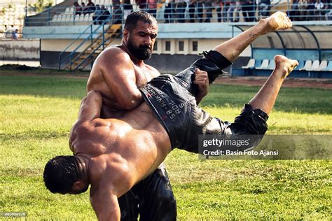 Two wrestlers compete during the 7th Turkish oil wrestling tournament ...