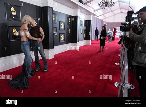 Tim Nelson, left, and Sam Netterfield of Cub Sport kiss as they arrive ...
