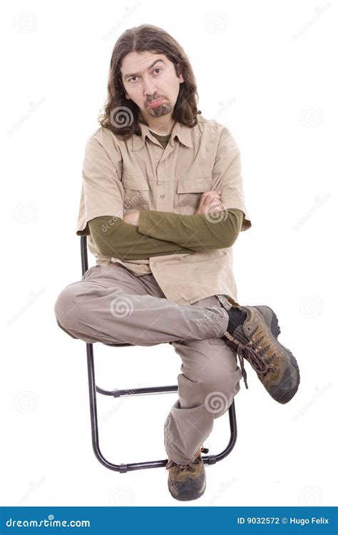 Sad man sitting on a chair stock photo. Image of full - 9032572