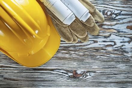 Hard Hat Construction Level Drawings On Editorial Stock Photo - Stock ...