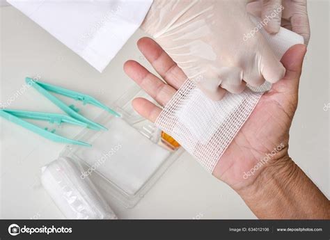 Doctor Doing Wound Dressing Care Bandaging Patient's Hand Hand Surgery ...