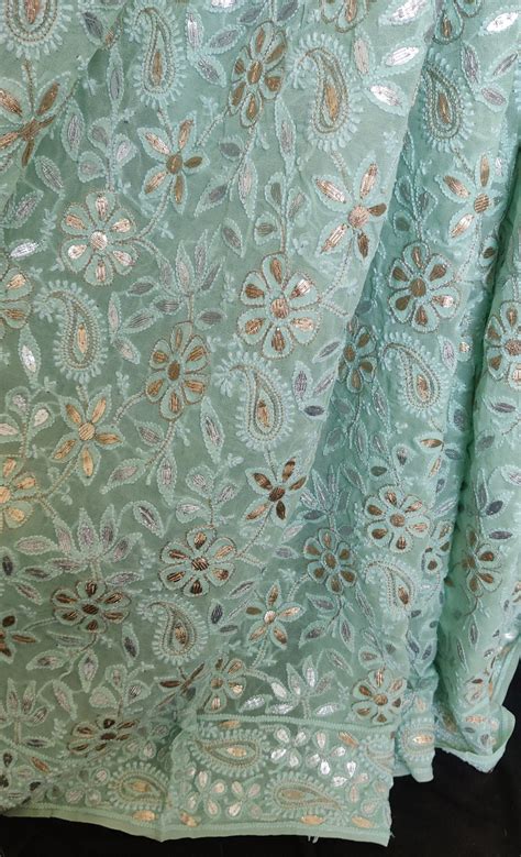 Ruhani sea green allover Chikankari and gota patti saree