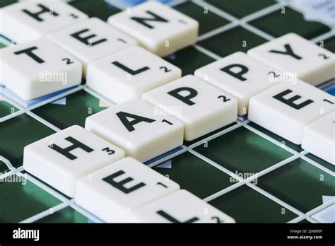 Happy word made of scrabble pieces blocks letters on board Stock Photo ...