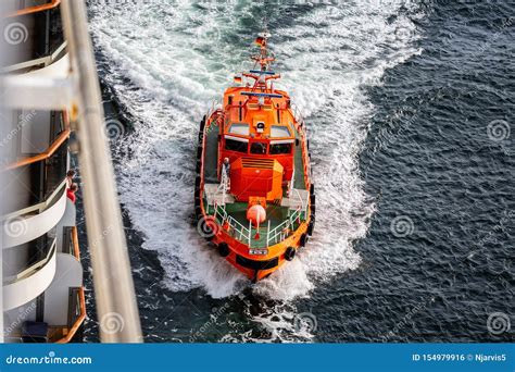 German Pilot Boat Pulling Alonside a Cruise Ship at Speed at Sea Near ...
