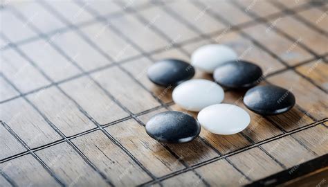 White and black round stones for Korean board game Go Weichi Chinese ...