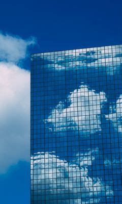 Download wallpaper 240x400 building, reflection, facade, glassy, clouds ...
