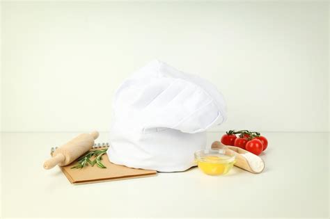 Concept of cooking food with chef hat | Premium Photo