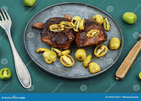 Grilled Ostrich Steak with Kiwi Berries Stock Image - Image of fork ...
