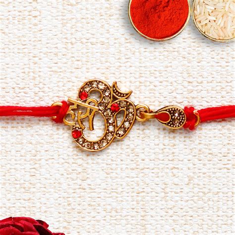 Designer Om Rakhi with Lord Ganesha on Kundan Studded Marble Chowki and ...