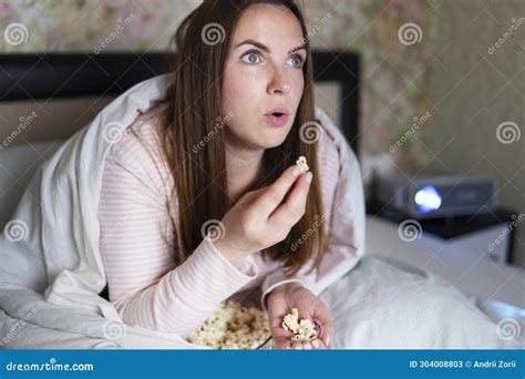Woman Eating Popcorn Watching Movie at Home Stock Image - Image of ...