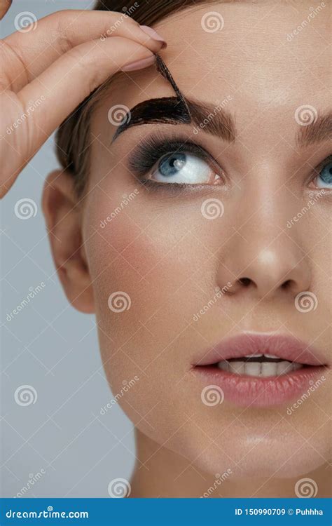 Eyebrow Cosmetics. Woman Taking Off Brow Gel Tint from Eyebrow Stock ...