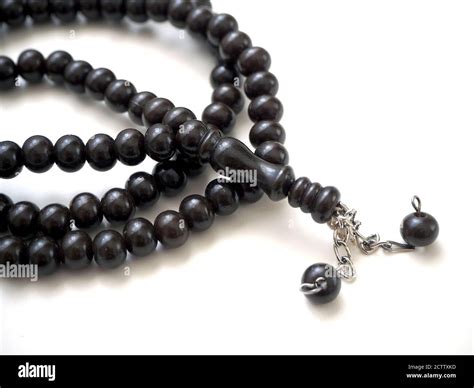 99 Islamic prayer beads on a white background Stock Photo - Alamy