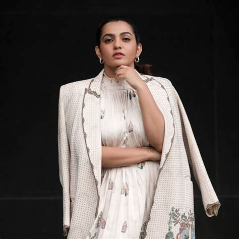Parvathy poses exceptionally in a Western Outfit for Tangalan Promo