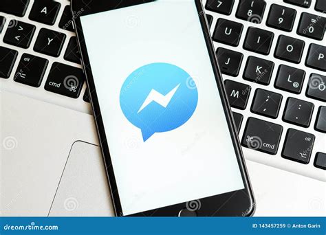 Black IPhone with Logo of Social Media Facebook Messenger on the Screen ...