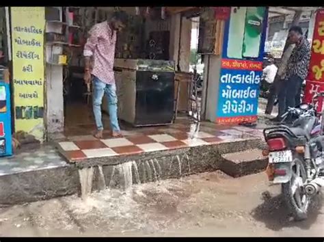 Water suddenly gushed out of a mobile shop near the Gondal bus stand ...