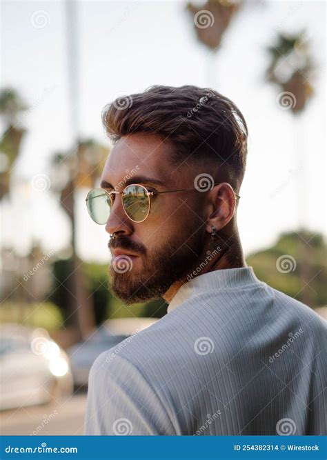 Young Spanish Handsome Man with a Stylish Hairstyle, Tattoos, and Sunglasses Stock Photo - Image ...
