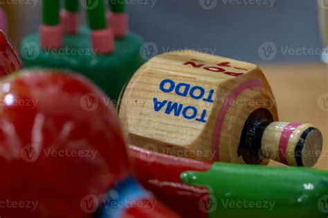Traditional pirinola mexican handmade wooden toy with titles in spanish ...