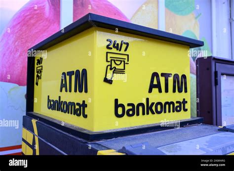 A man walks past an automated teller machine (ATM) outside Bank of America Corp. headquarters in Cha