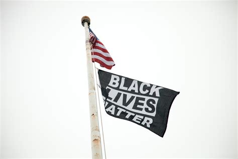 SLIDESHOW: Black Lives Matter flag raised at Montpelier High School ...