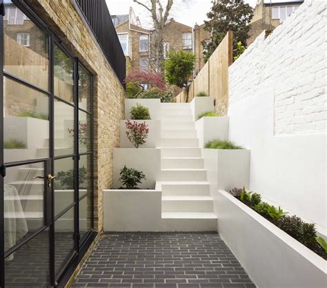 Stairs With Built-In Planters Lead To The Back Garden At This Home ...