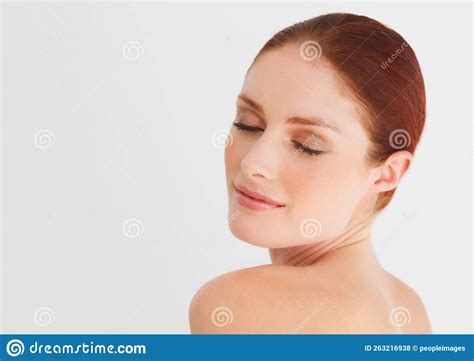 Soft and Sensual. a Young, Beautiful Woman Looking Over Her Shoulder ...