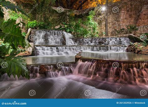 Long Exposure Shot of Waterfalls Surrounded by Brick Walls and Trees ...