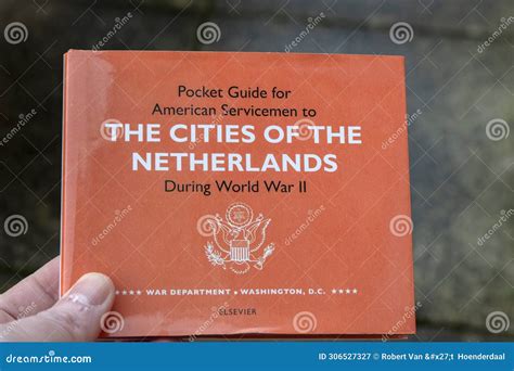 Holding a Pocket Guide for American Servicemen of the Cities of the ...