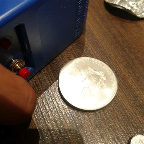 How to test if silver coin is real. Silver is diamagnet and is repelled ...