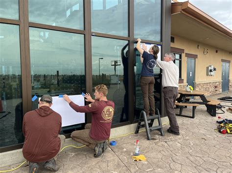 ACE Interns and RMA Staff install Bird Safe Glass at RMA NWR | FWS.gov