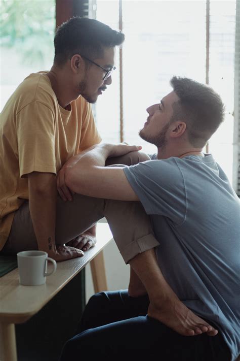 Download Gay Men Gazing Into Eyes Wallpaper | Wallpapers.com