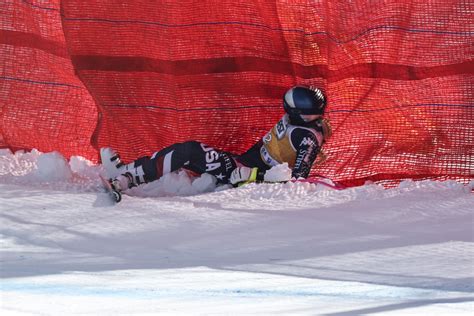 United States' Lindsey Vonn crashes into a gate during an alpine ski women's downhill race, at the 2026 Winter Olympics, in Cortina d'Ampezzo, Italy, Sunday, Feb. 8, 2026. (AP Photo/Jacquelyn Martin)