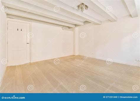 An Empty Room with White Walls and a Wooden Floor Stock Photo - Image ...
