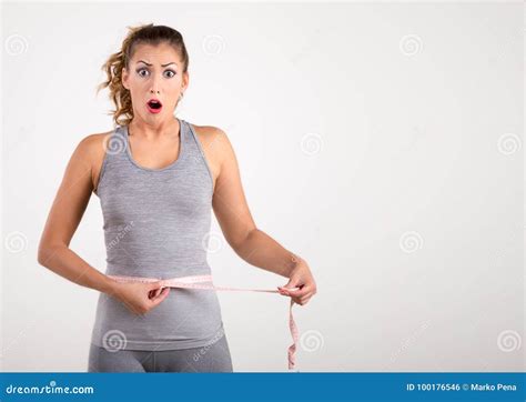Happy Fitness Girl Measuring Her Waist with Tape Measure Stock Photo ...