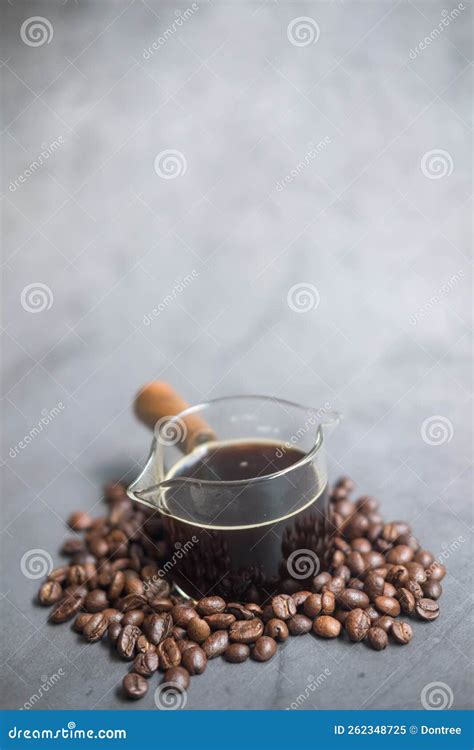 Shot of Hot Espresso Coffee in a Small Glass with a Wooden Handle ...