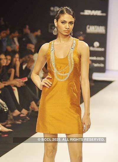 A model showcases a creation by designer Lina Tipnis on Day 6 of the ...