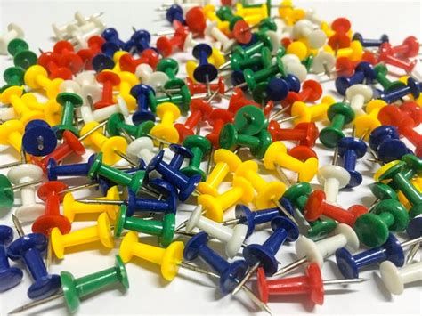 Thumbtacks on table | Premium Photo