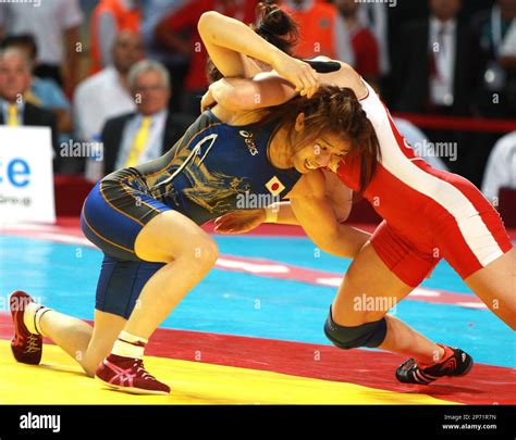 Two-time Olympic wrestling champion Saori Yoshida of Japan (L) fights ...