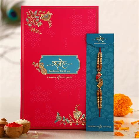 Send Divine Swastik Paduka Pearl Rakhi - Dubai Online | Rakhibazaar.com