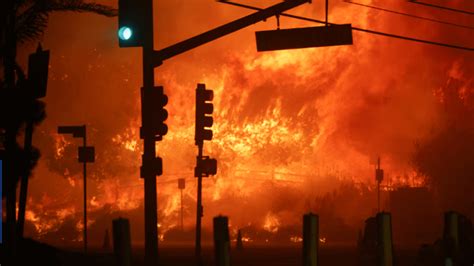 Wildfire rages in Los Angeles, forcing 30,000 to evacuate