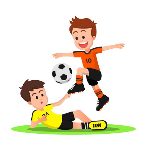 Young football player avoids a sliding tackle from his opponent ...