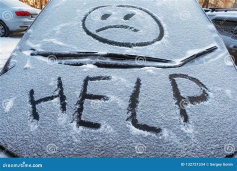 Closeup of Wipers and Frosted Car Windshield Covered with Ice and Snow. Winter Weather ...