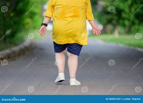 Back View Fat Asian Girl Exercising by Walking To Burn Fat and Jogging ...
