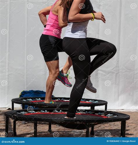 Mini Trampoline Workout: Girl Doing Fitness Exercise in Class at Stock Photo - Image of muscle ...